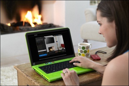 A woman sat at her laptop using the TV suide size tool